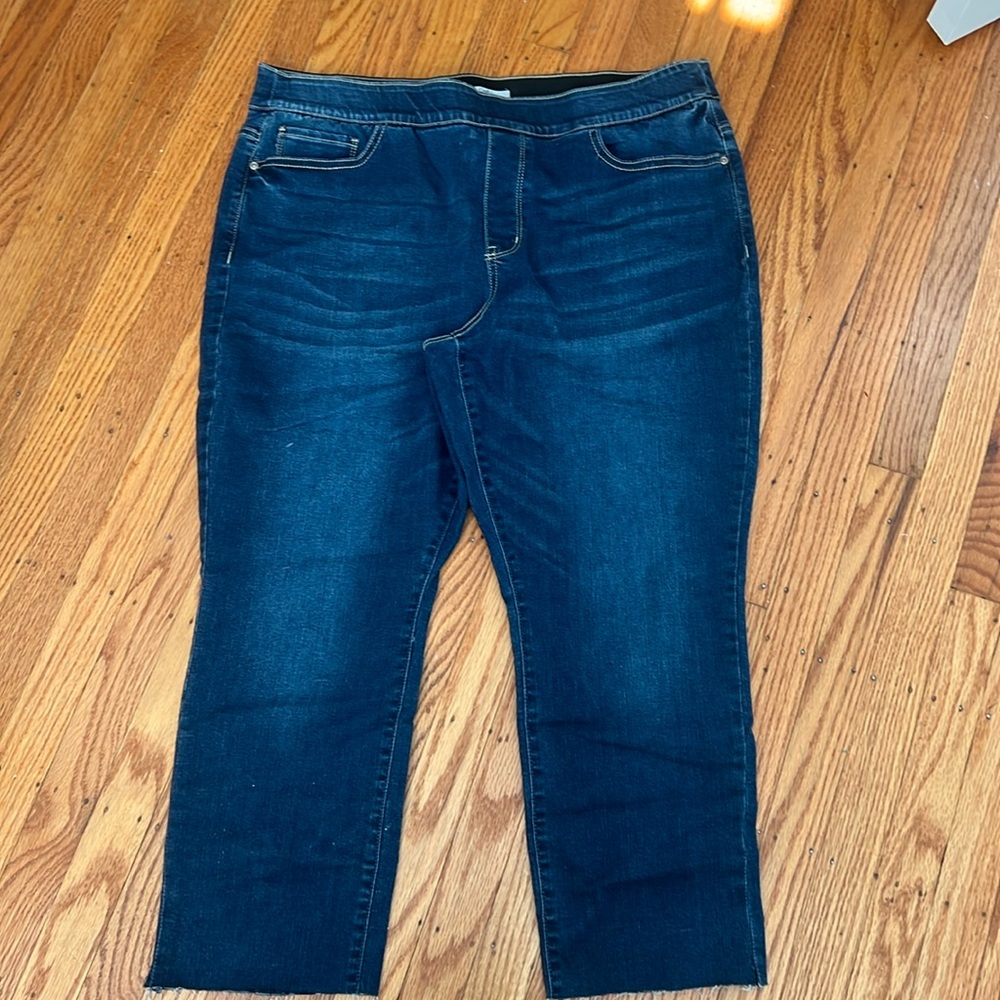 Pull on jeans with rough hem gently worn